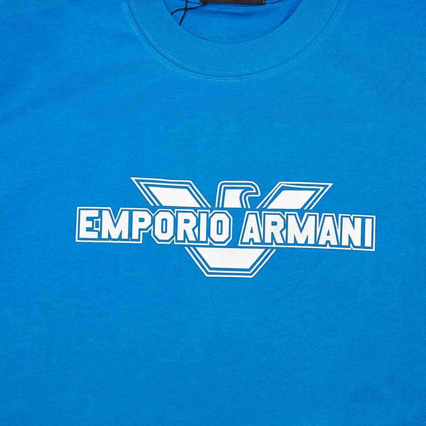 Cobalt Blue Emporio Armani t-shirt with large white framed Eagle logo on chest, designer unisex casual wear.