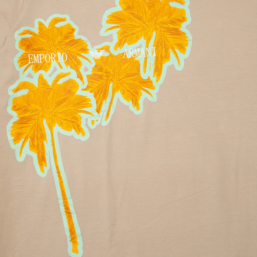 Beige Emporio Armani t-shirt with large yellow neon palm tree graphic and logo on chest, designer unisex casual wear.