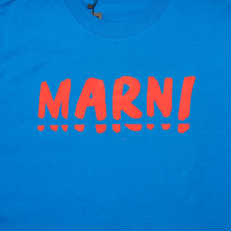 Royal Blue Marni t-shirt with large red brushstroke logo graphic on chest, short sleeves, designer unisex streetwear.