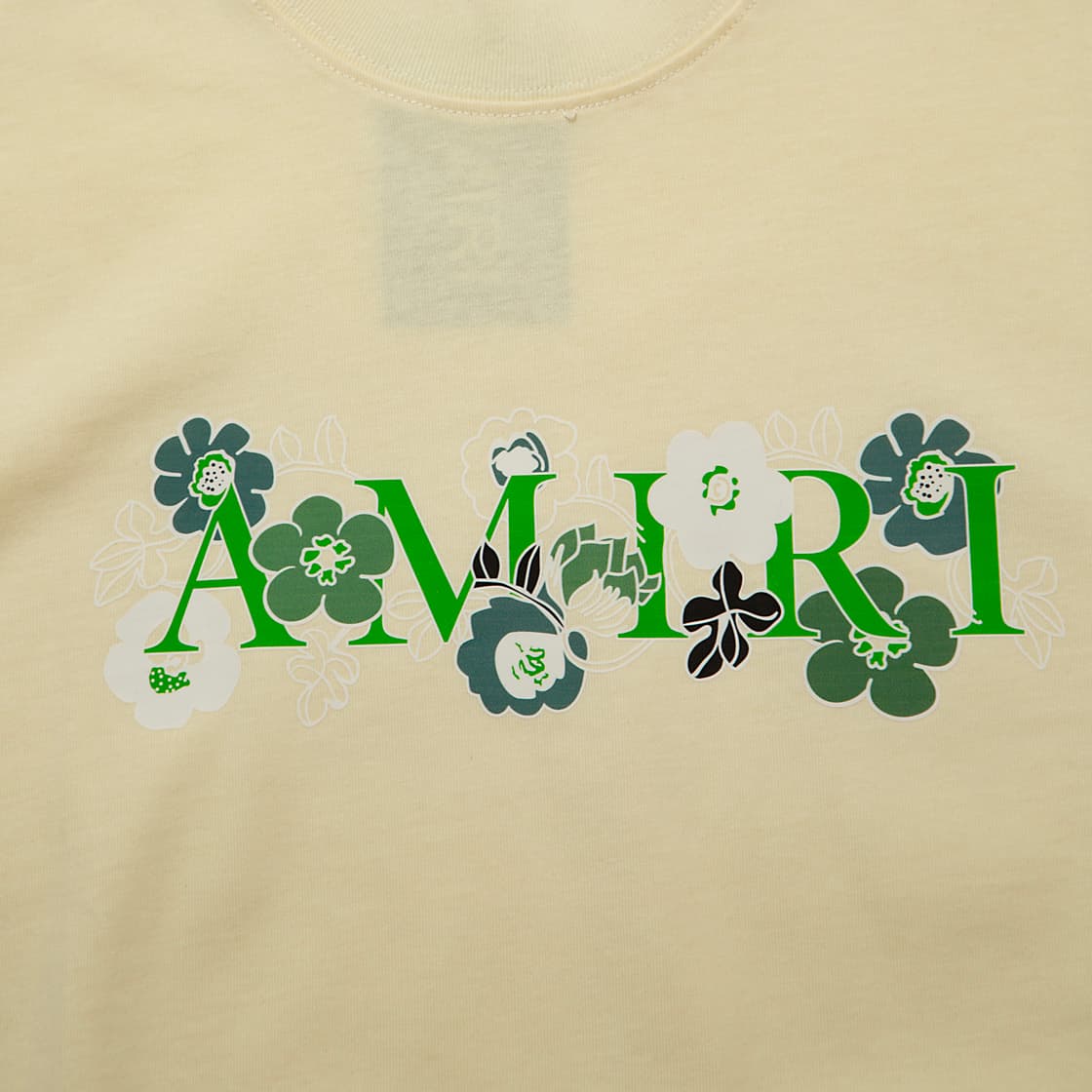 This is a premium, fashion-forward sleeveless t-shirt or tank top, featuring the brand name AMIRI embroidered or printed across the chest.
