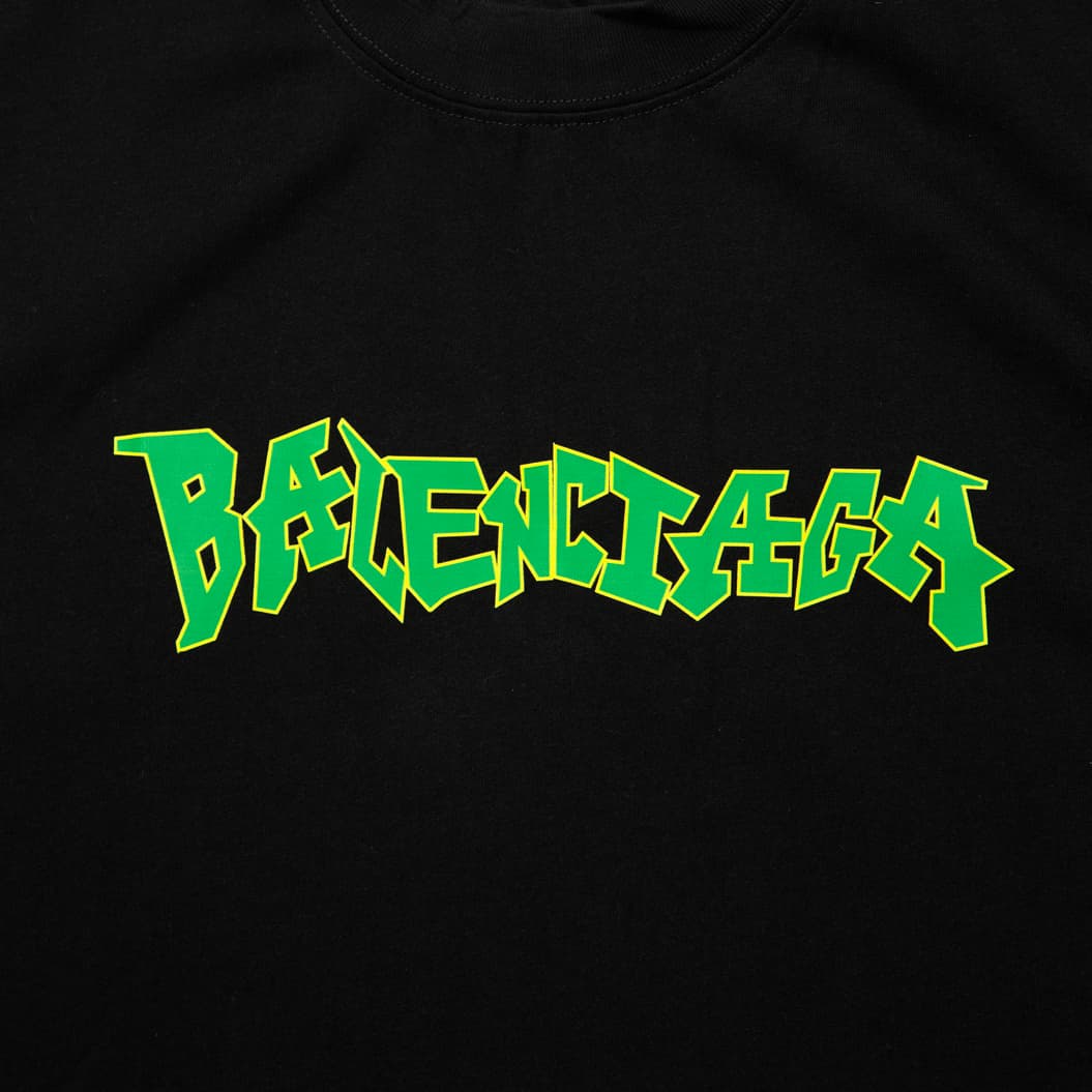 Black Balenciaga sleeveless t-shirt with neon green graffiti logo print, luxury cotton designer streetwear, unisex.