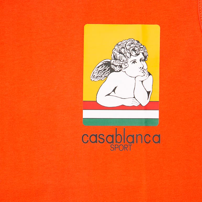 This is a high-impact, sleeveless t-shirt or tank top known for its vibrant base colour and small, distinctive graphic print on the left chest.