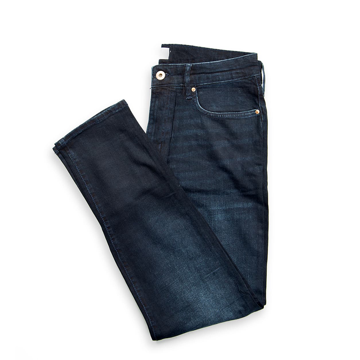 These are a pair of modern slim-fit jeans in a deep, rich indigo denim with a subtle wash and fading effect, primarily on the thighs.