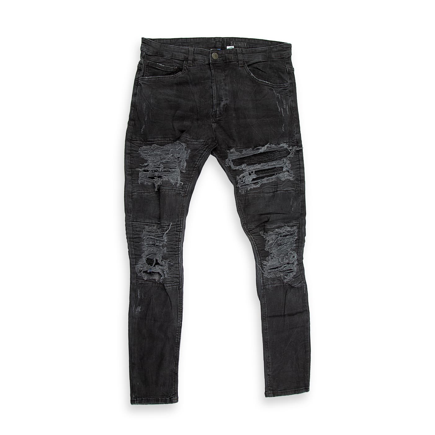 These are a pair of highly distressed skinny-fit jeans in a faded, washed black or charcoal colour.
