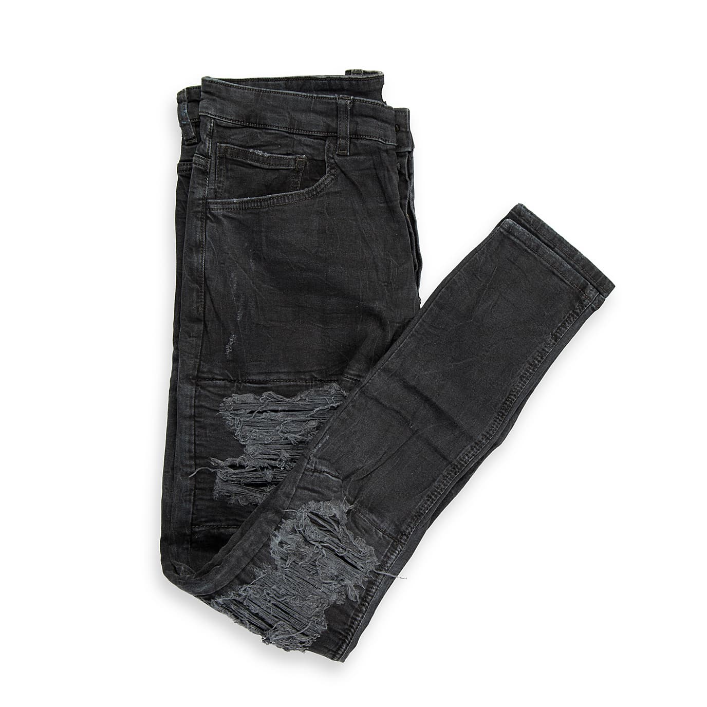 These are a pair of highly distressed skinny-fit jeans in a faded, washed black or charcoal colour.