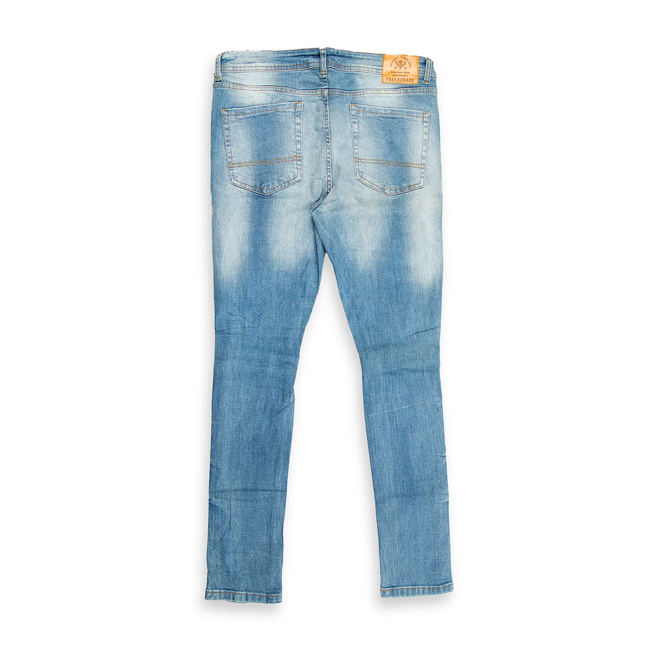 These are skinny-fit denim jeans featuring a light blue wash with a vintage, slightly faded appearance.