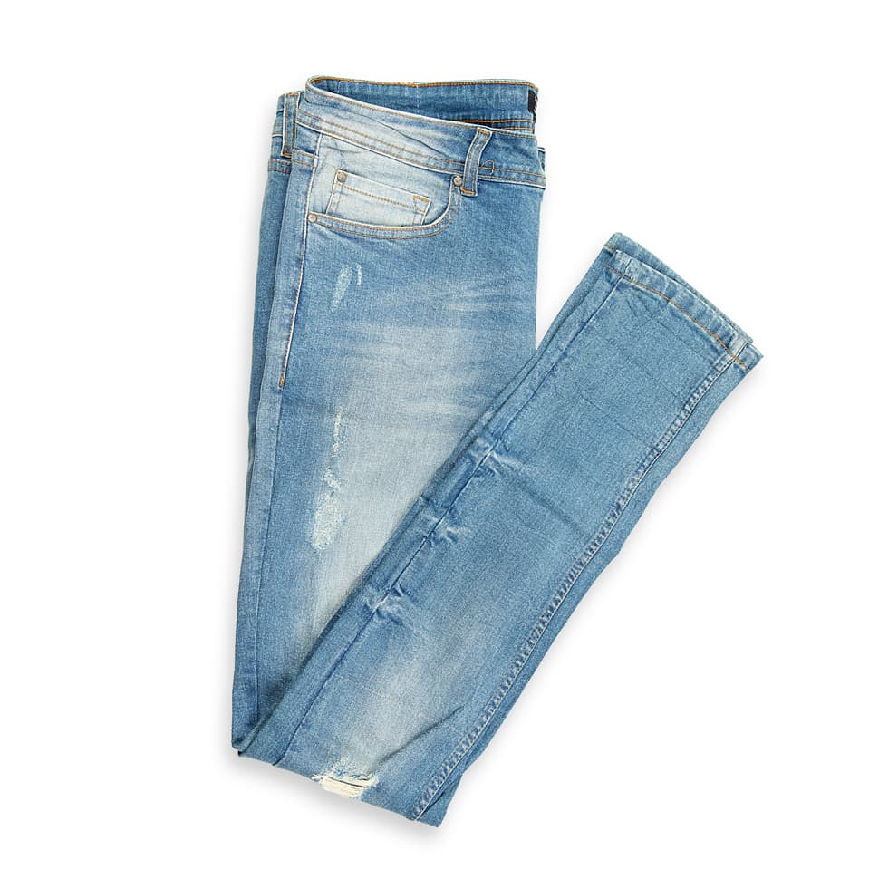 These are skinny-fit denim jeans featuring a light blue wash with a vintage, slightly faded appearance.
