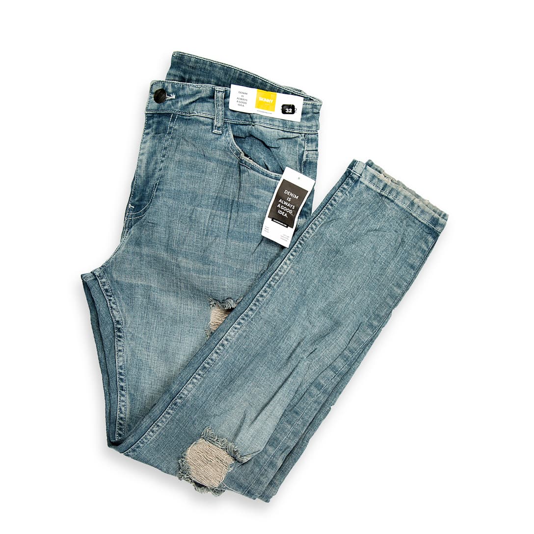 These are a pair of slim-fit denim jeans featuring a contemporary light-wash finish. They have a mid-rise waist and a tapered leg that runs slim through the thigh and calf.