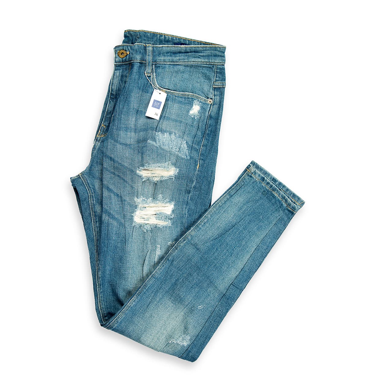 These are a pair of skinny-fit jeans featuring a distressed medium/vintage blue wash. The denim has a slight textural grain and natural fading across the thighs and seat, giving them a worn-in, authentic look.