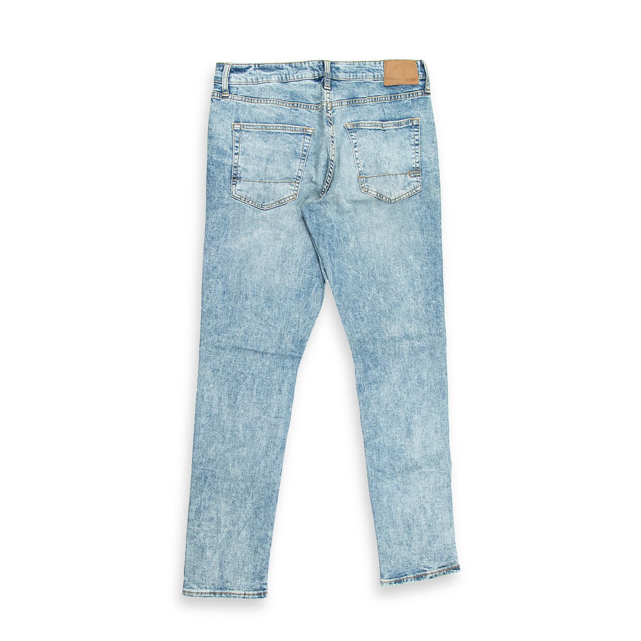 These are a pair of skinny-fit jeans featuring a striking high-contrast acid wash (or mineral/snow wash). The wash results in a dramatic pattern of light blue/near-white spots and streaks against a medium blue denim base, giving them a retro, yet edgy aesthetic.