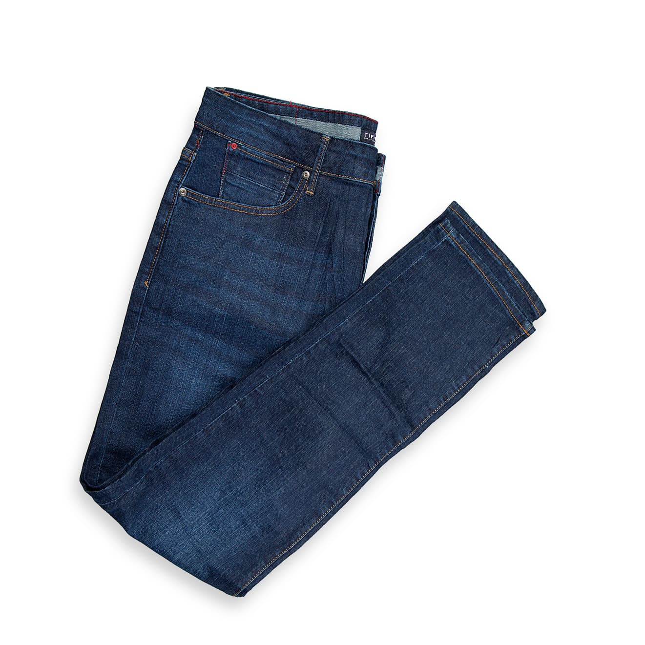 These are a pair of slim-straight fit jeans in a deep, rich dark indigo blue wash. The denim has a clean, saturated appearance with only subtle, natural whiskering and fading on the upper thighs, providing depth without the distraction of heavy distressing.