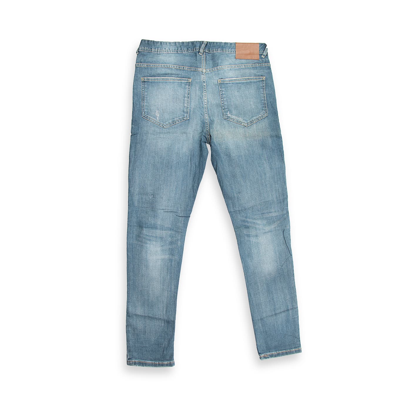 These are a pair of slim-fit denim jeans in a contemporary mid-blue wash. The denim features subtle fading and light whiskering, giving them a slightly broken-in look.