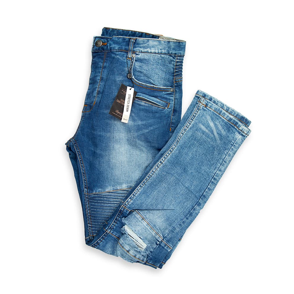These are a pair of slim-fit moto jeans in a medium-blue wash with natural fading and whiskering across the front.