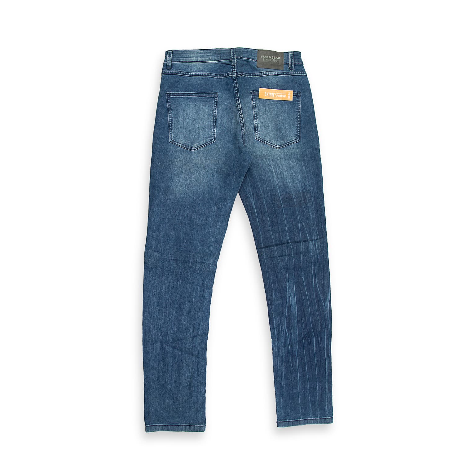 These are a pair of slim-fit moto jeans in a saturated dark blue/indigo wash. The denim has subtle fading and whiskering primarily on the thighs.