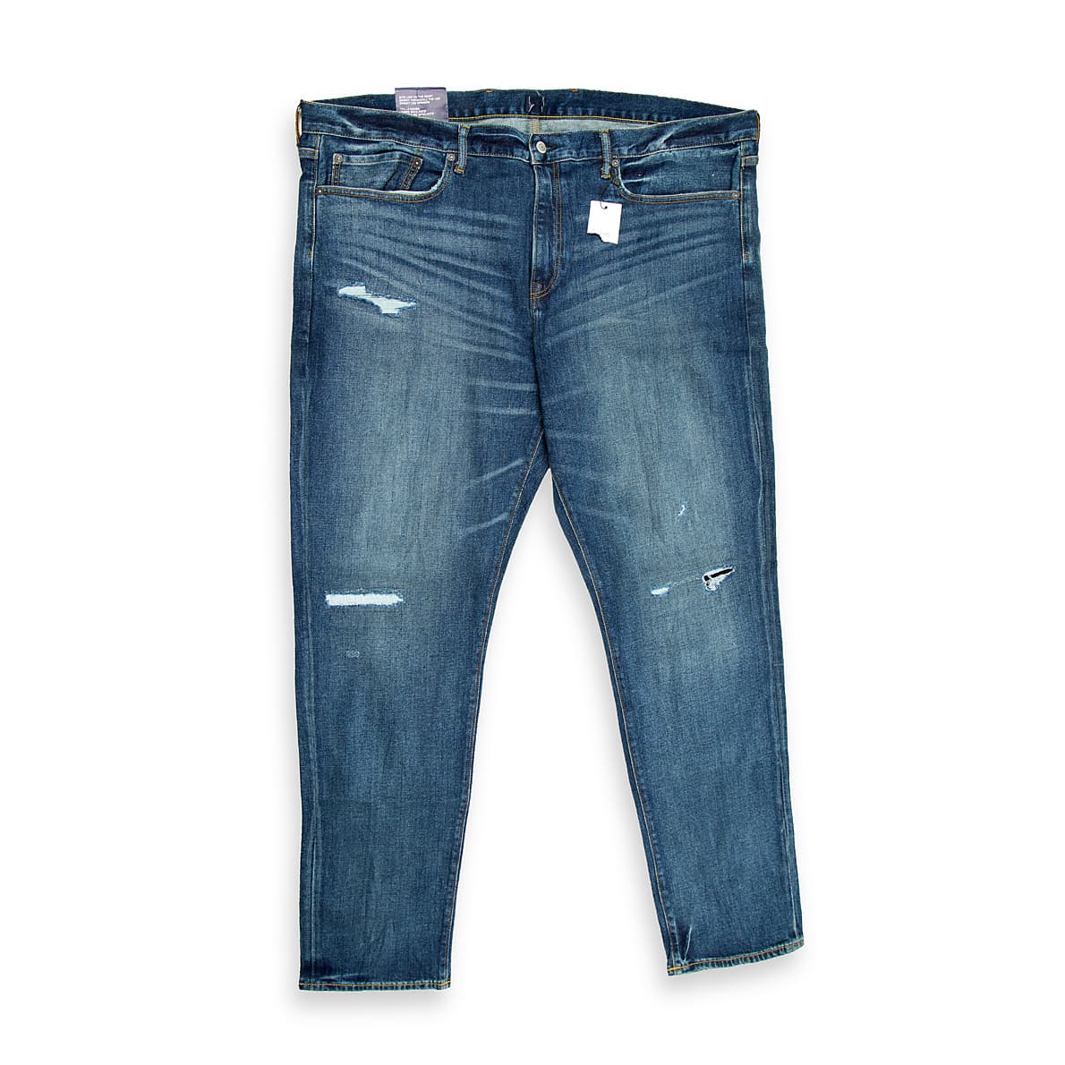 "Men’s blue distressed slim-fit jeans with ripped design – front view on white background."