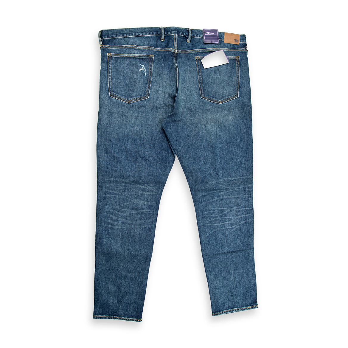"Men’s blue distressed slim-fit jeans with ripped design – front view on white background."