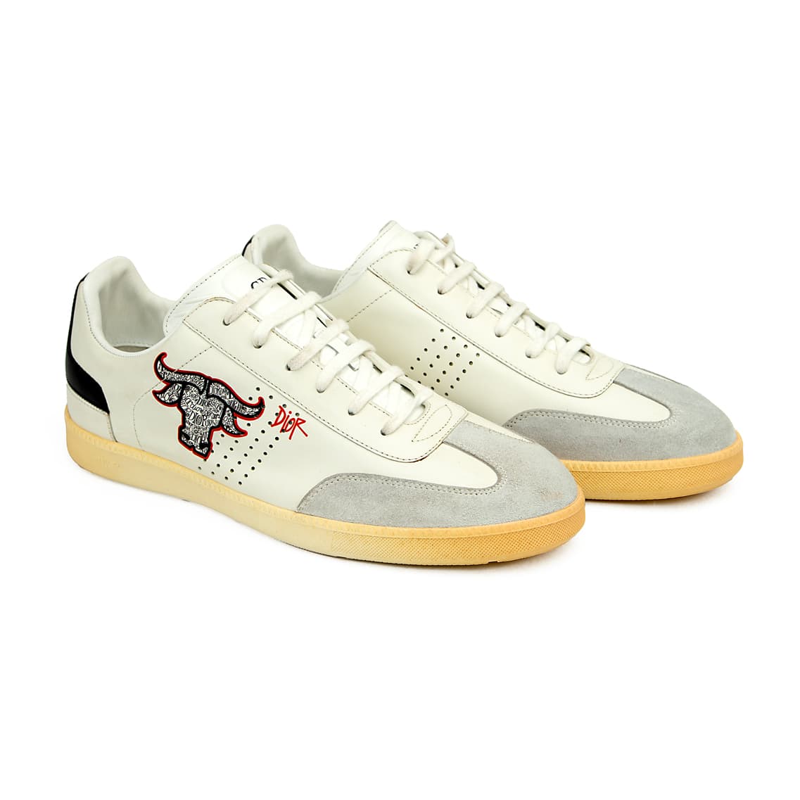 This is a low-top sneaker from the collaboration between Dior and artist Shawn Stussy, part of the Dior Men's Spring 2020 collection.
