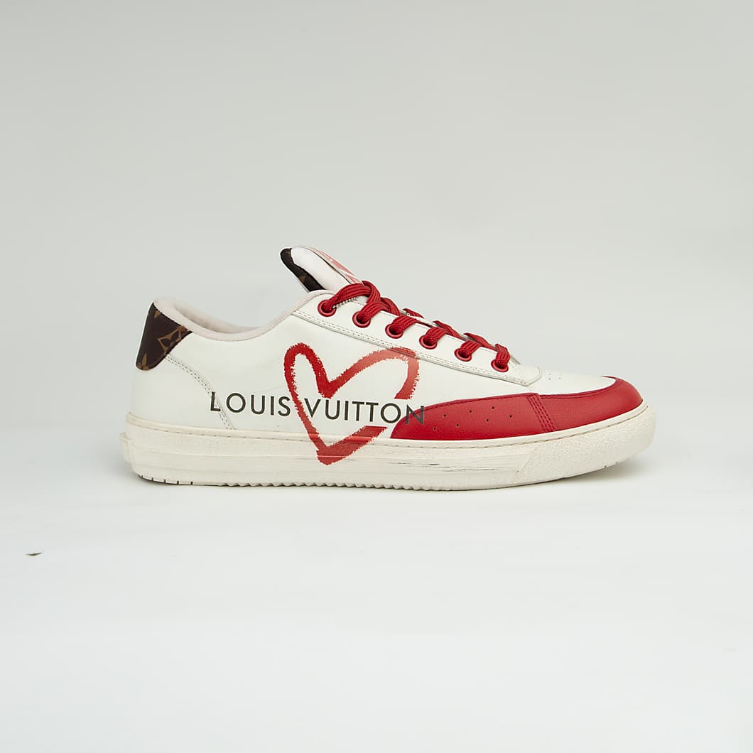 The LV Trainer Sneaker is a luxury low-top sneaker that blends high-fashion craftsmanship with a retro basketball and skate shoe aesthetic.