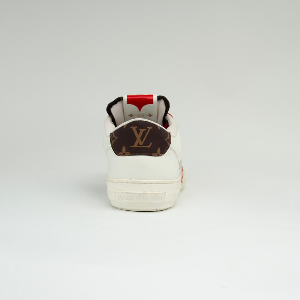 The LV Trainer Sneaker is a luxury low-top sneaker that blends high-fashion craftsmanship with a retro basketball and skate shoe aesthetic.
