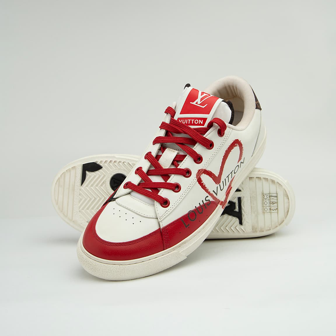 The LV Trainer Sneaker is a luxury low-top sneaker that blends high-fashion craftsmanship with a retro basketball and skate shoe aesthetic.