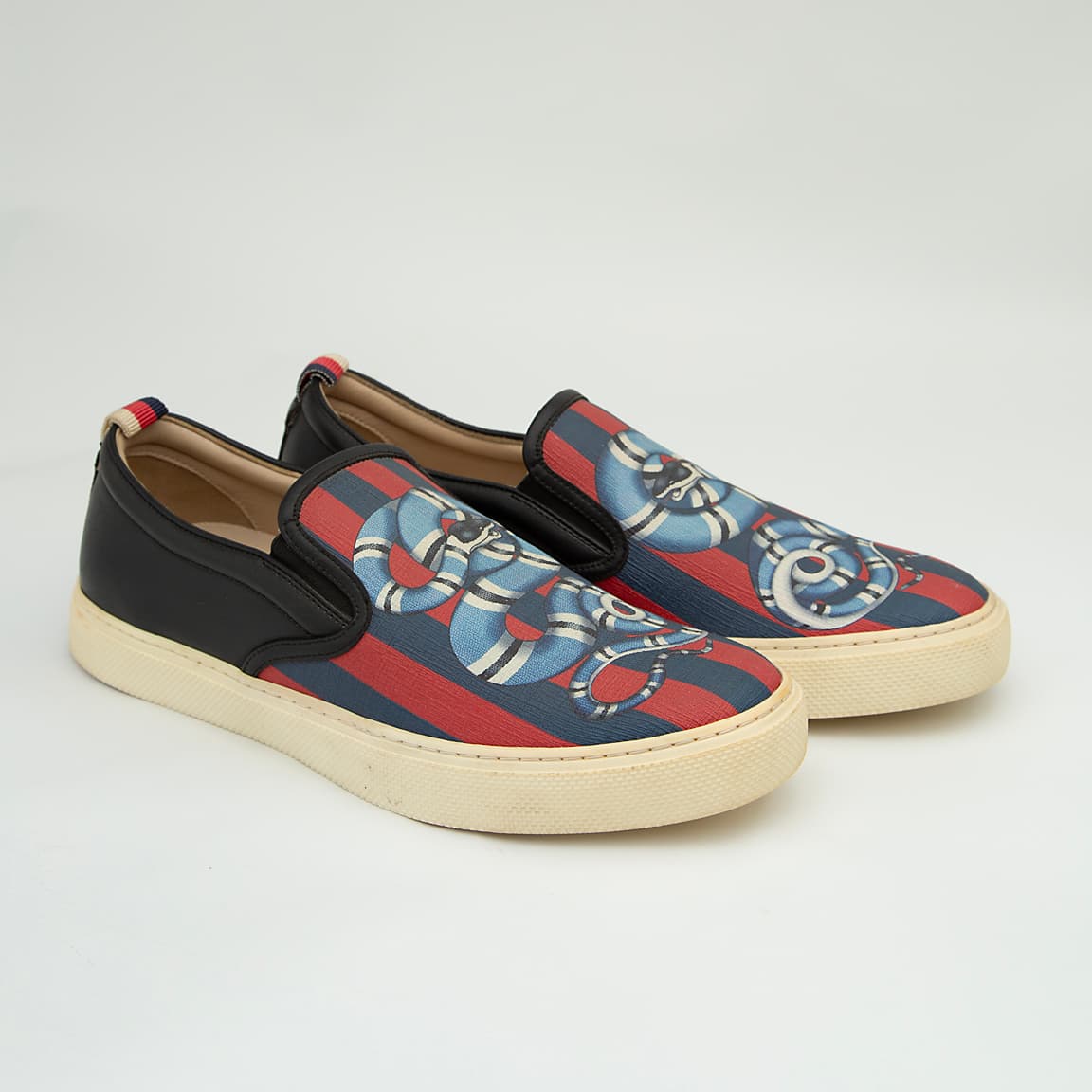 The Garden Serpent Slip-On is a high-luxury, casual shoe that blends Gucci's iconic heritage web with bold, striking graphic art.
