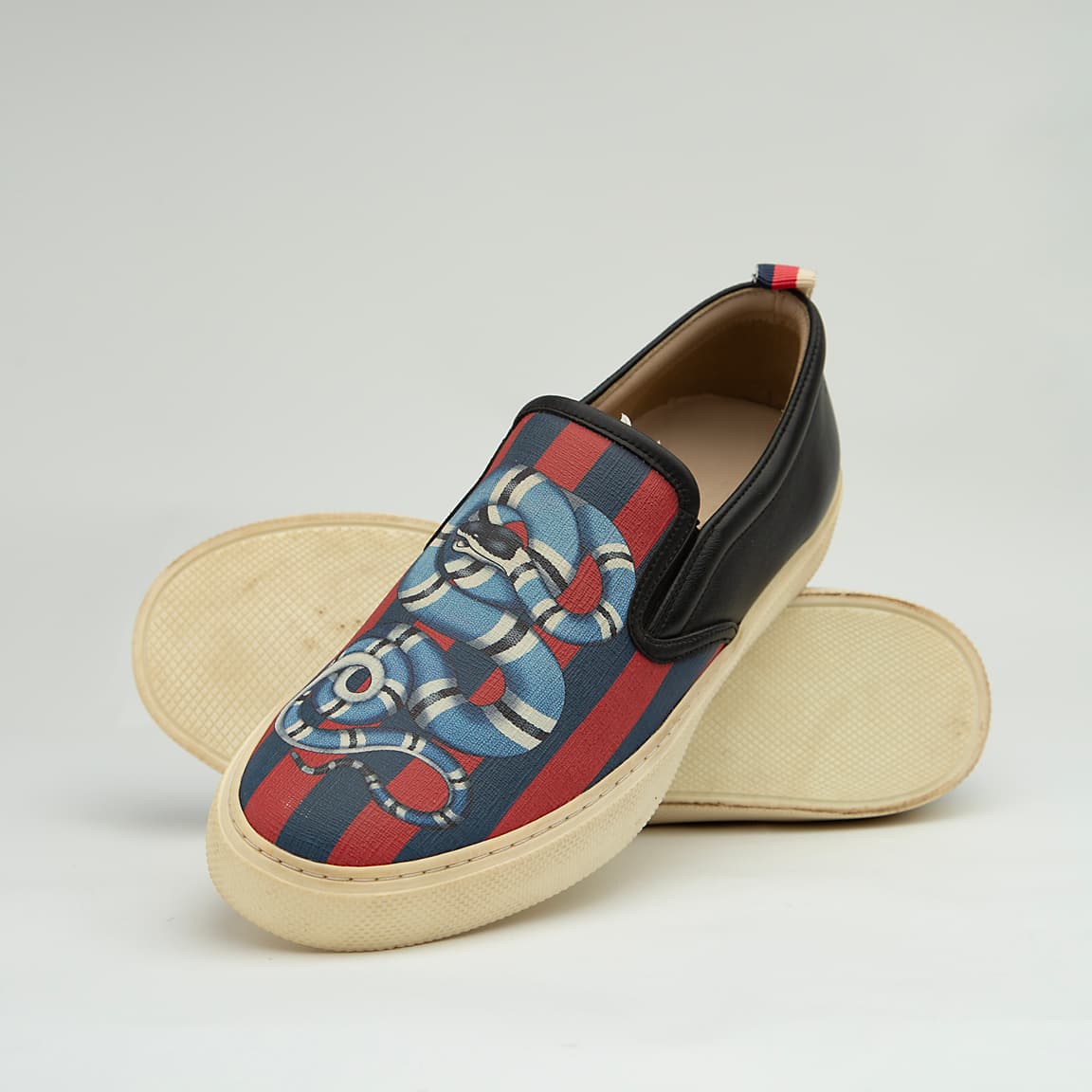 The Garden Serpent Slip-On is a high-luxury, casual shoe that blends Gucci's iconic heritage web with bold, striking graphic art.
