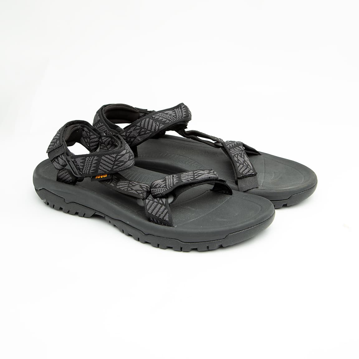 Black unisex outdoor sandals with patterned adjustable straps and rugged sole.