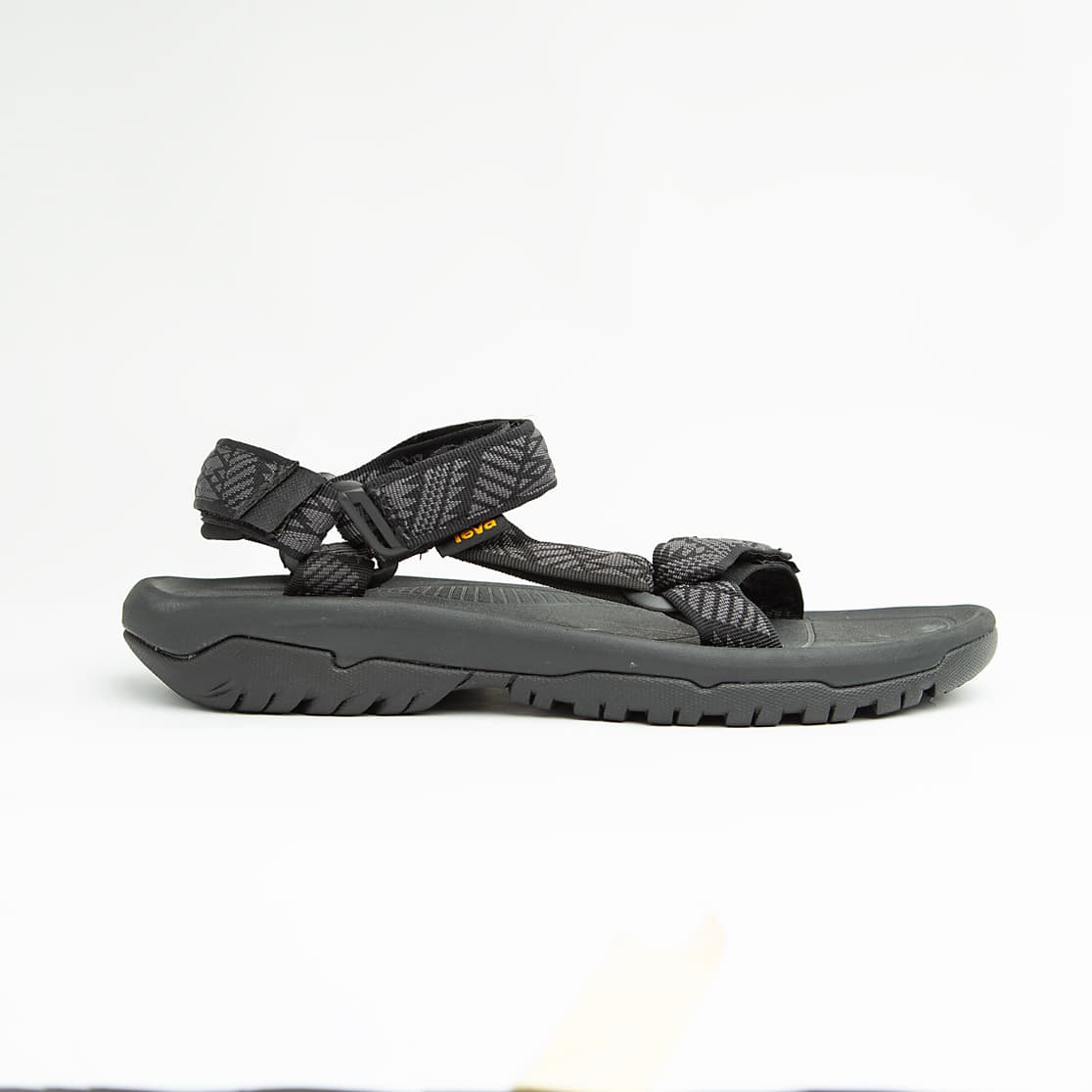 Black unisex outdoor sandals with patterned adjustable straps and rugged sole.