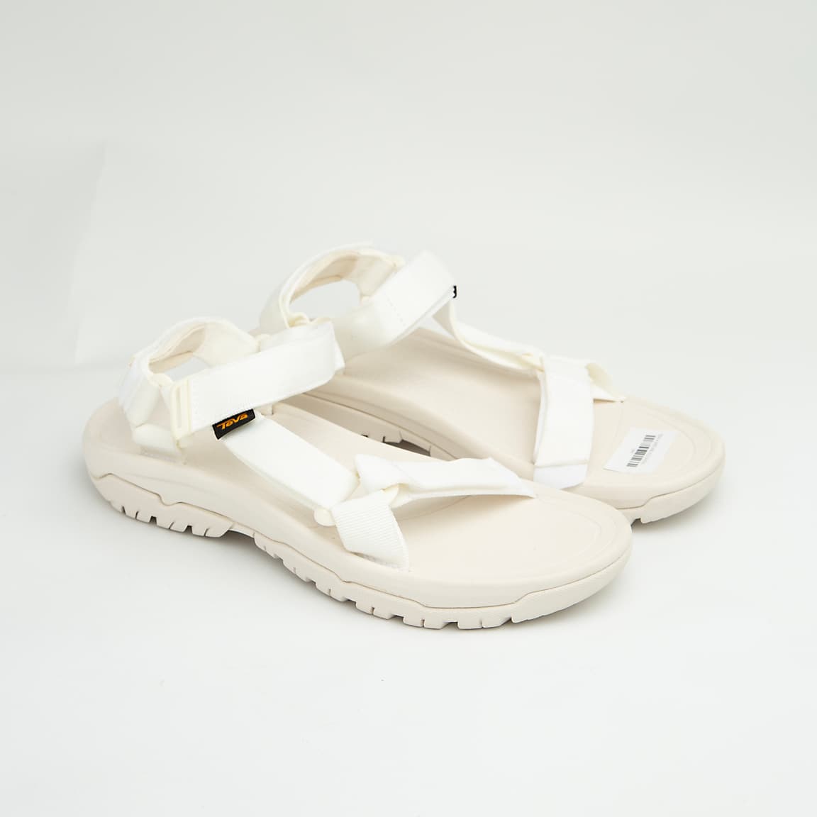 White all-terrain adjustable unisex outdoor sandals with EVA sole and hook-and-loop straps.