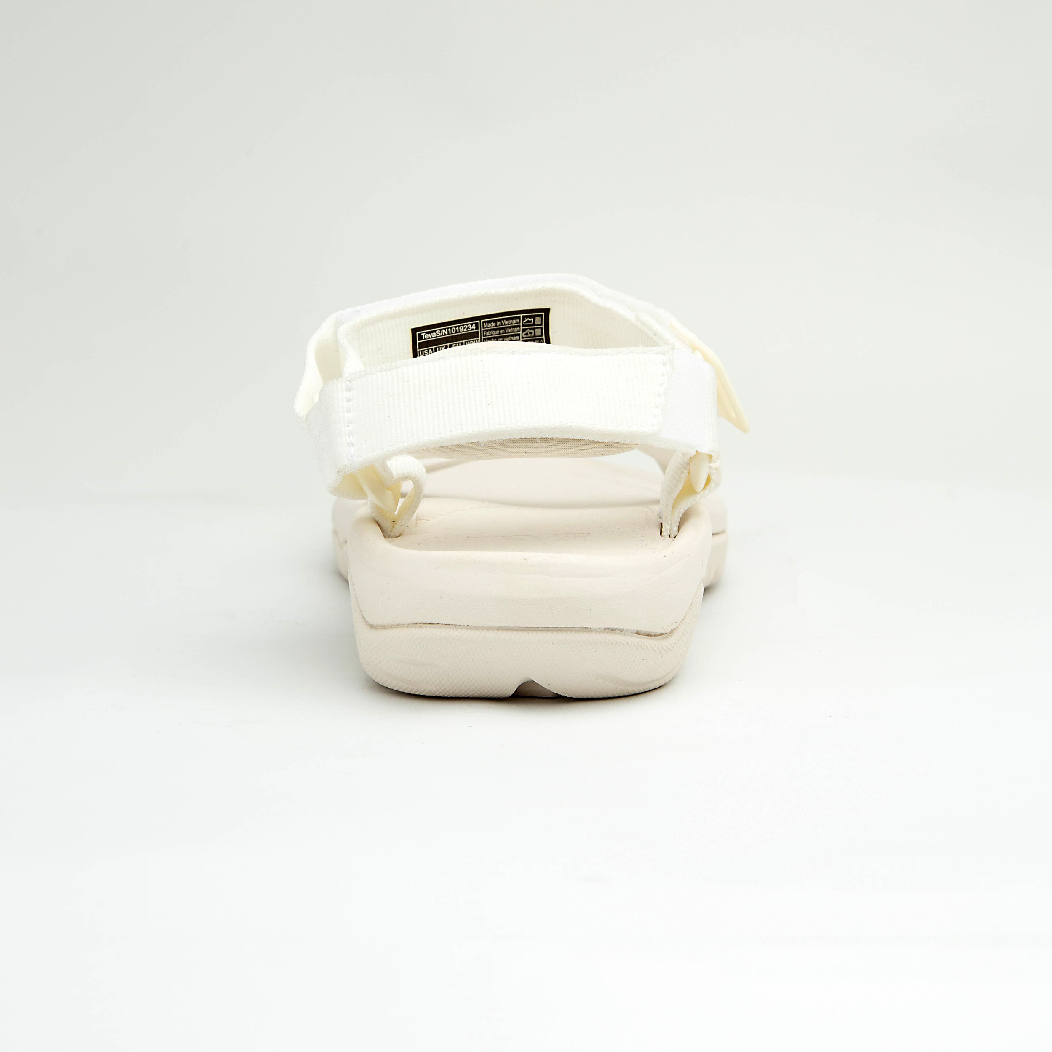 White all-terrain adjustable unisex outdoor sandals with EVA sole and hook-and-loop straps.