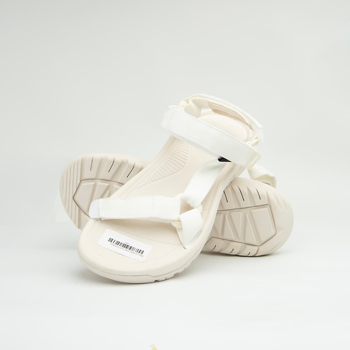 White all-terrain adjustable unisex outdoor sandals with EVA sole and hook-and-loop straps.