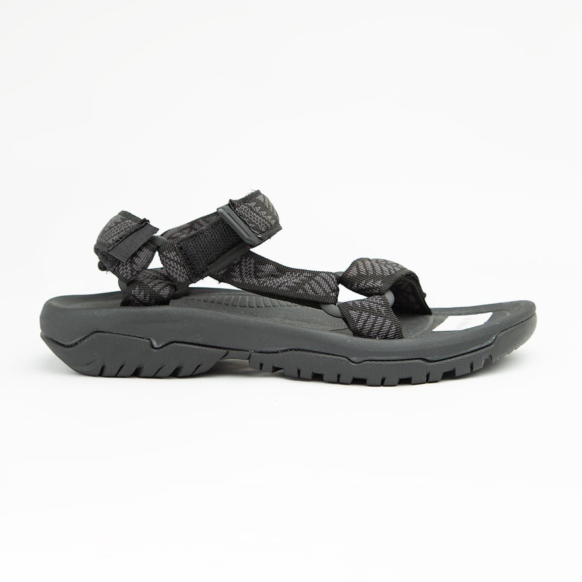 Black all-terrain unisex sport sandals with patterned adjustable straps and rugged rubber sole.