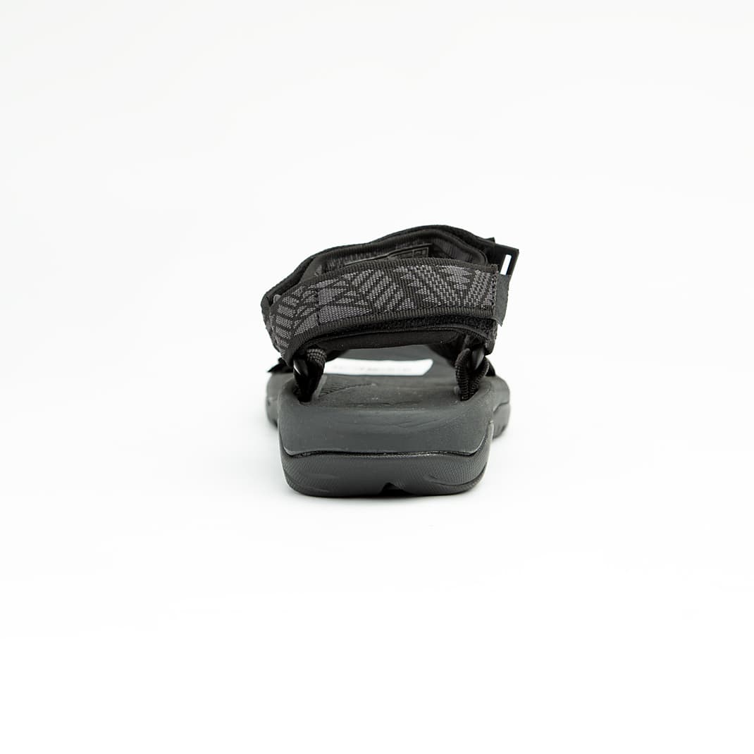 Black all-terrain unisex sport sandals with patterned adjustable straps and rugged rubber sole.