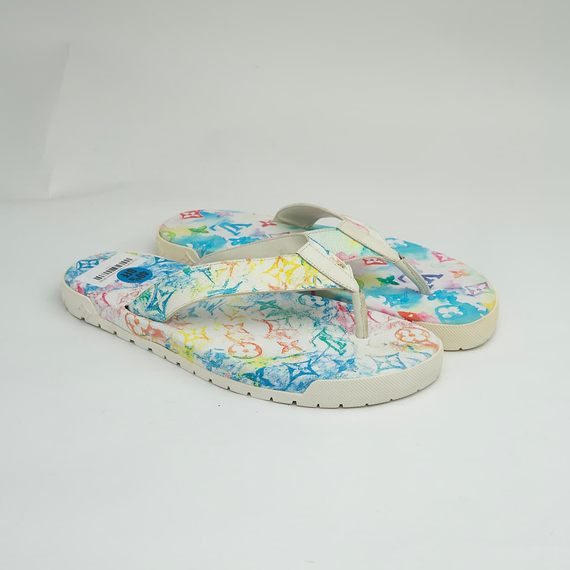 The Watercolor Voyage Thong is a luxurious, casual flip-flop designed for summer elegance.