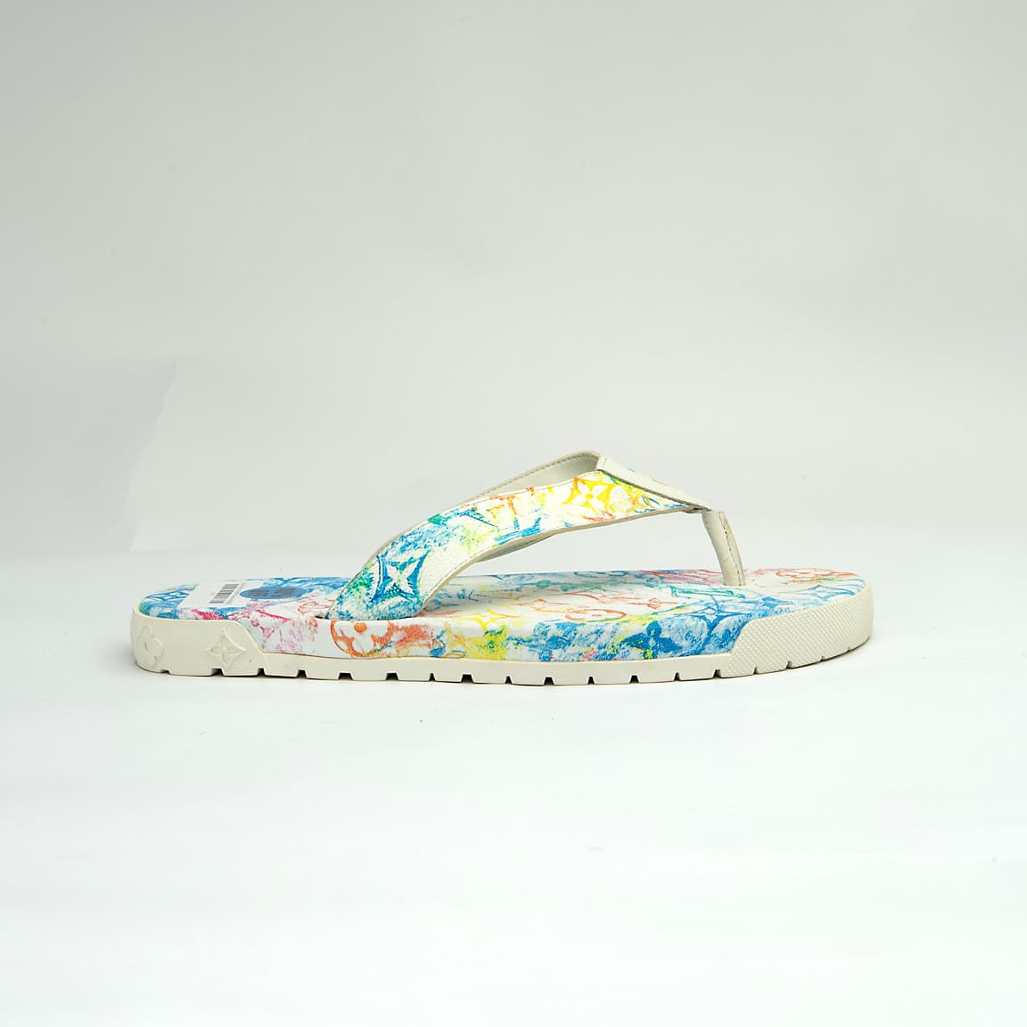 The Watercolor Voyage Thong is a luxurious, casual flip-flop designed for summer elegance.