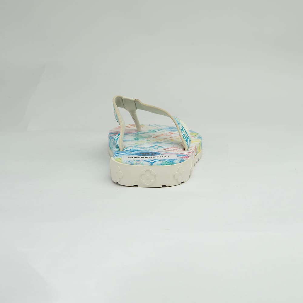 The Watercolor Voyage Thong is a luxurious, casual flip-flop designed for summer elegance.