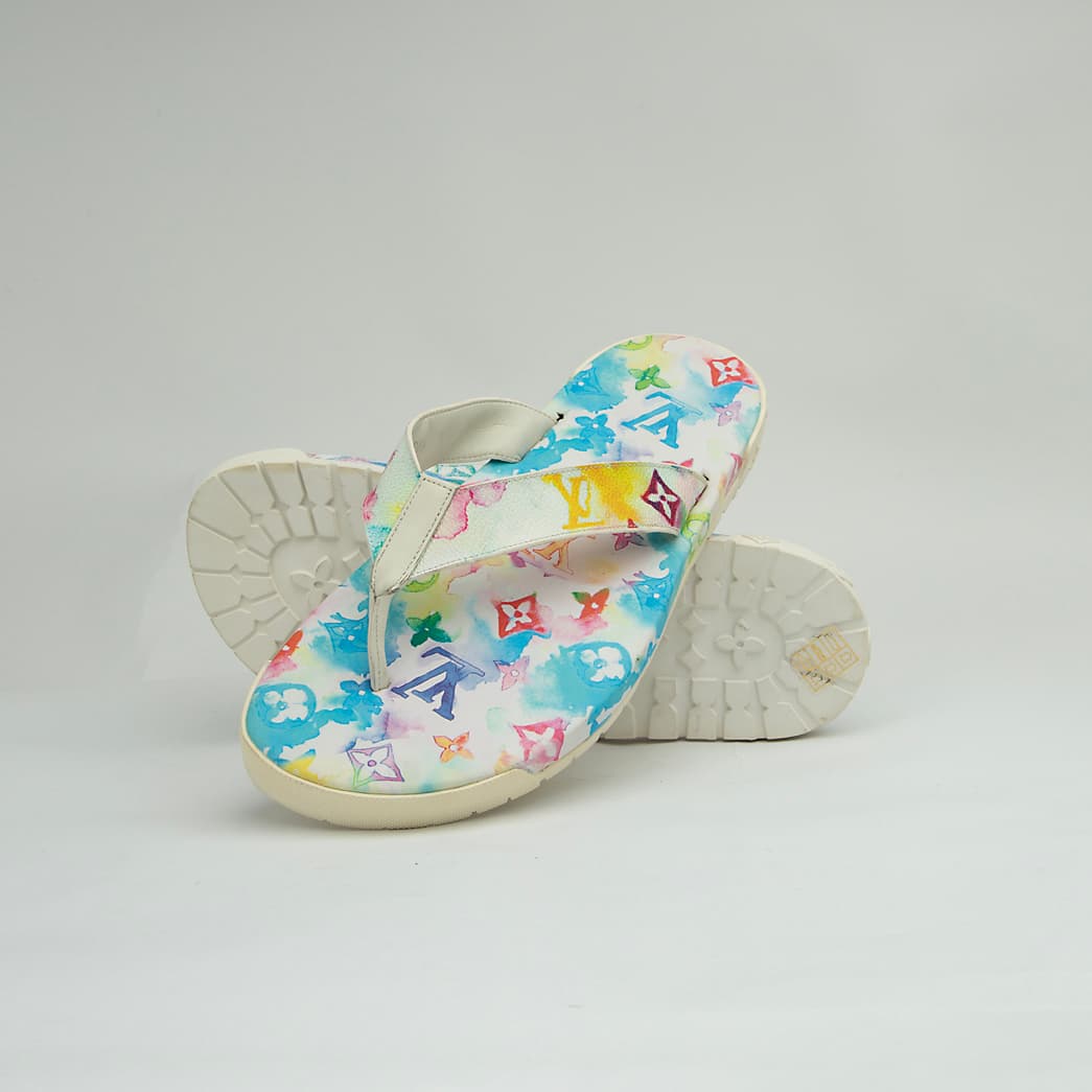 The Watercolor Voyage Thong is a luxurious, casual flip-flop designed for summer elegance.