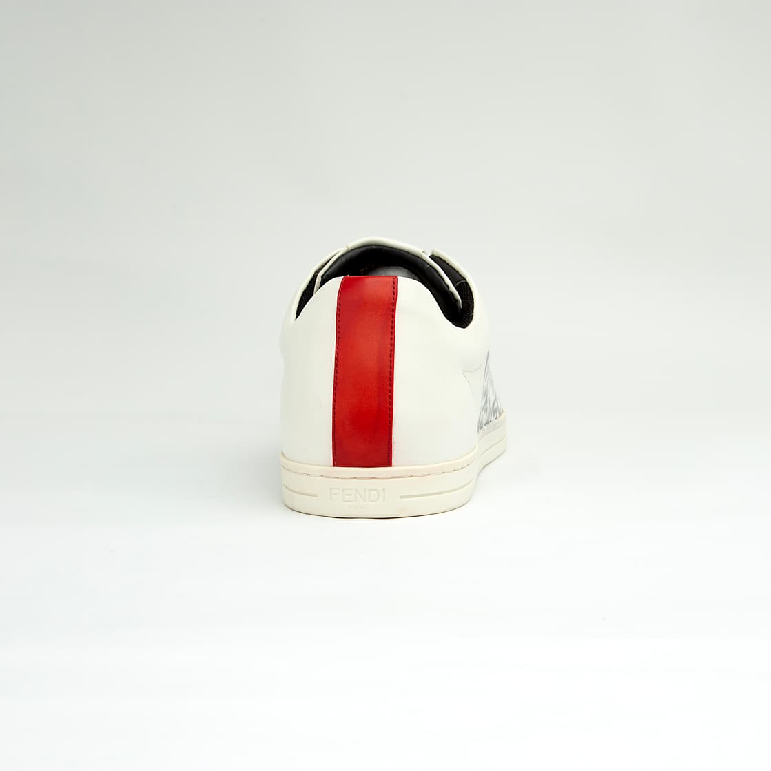 The White Tiger Skate Low is a clean, modern, low-top trainer with a luxury streetwear edge. It is crafted from smooth, premium white leather and features a distinctive black and white graphic drawing on the side panel, resembling a stylized tiger or abstract artwork.
