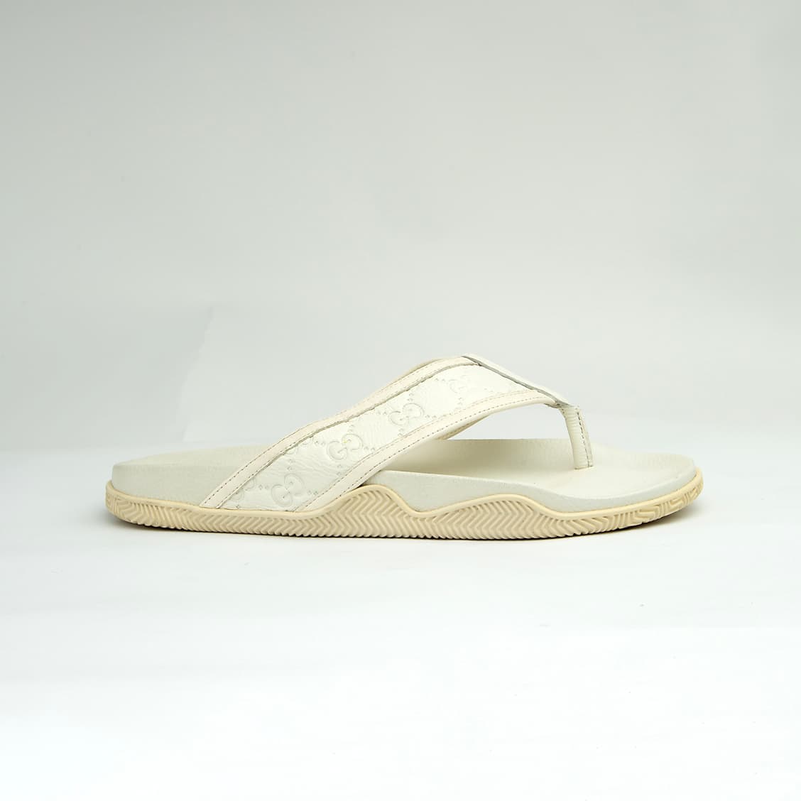 The Riviera Monogram Thong is a sophisticated, luxurious flip-flop designed for upscale resort or casual wear.