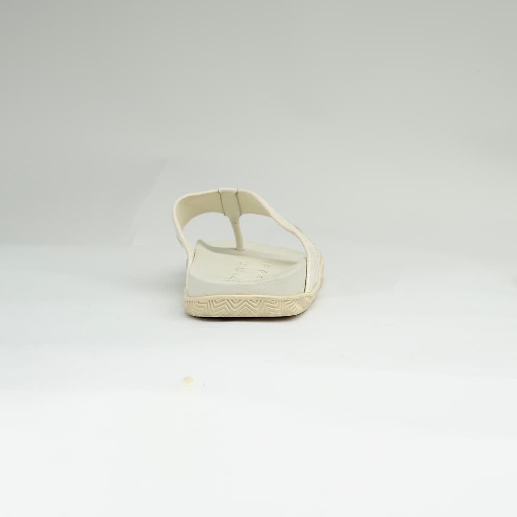 The Riviera Monogram Thong is a sophisticated, luxurious flip-flop designed for upscale resort or casual wear.