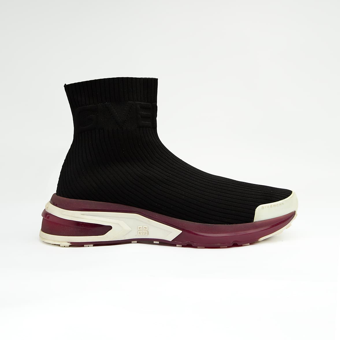The Obsidian Sock Runner is a high-fashion, high-top sneaker characterized by its minimalist, slip-on design and bold, futuristic sole.