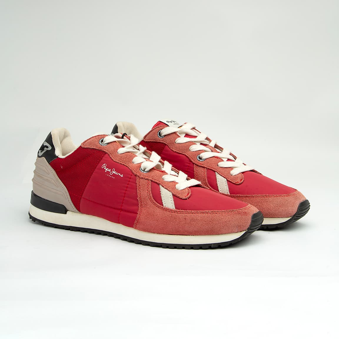 These are stylish, casual low-top sneakers featuring a mixed-material upper that includes a combination of suede, textile (mesh/nylon), and synthetic overlays.