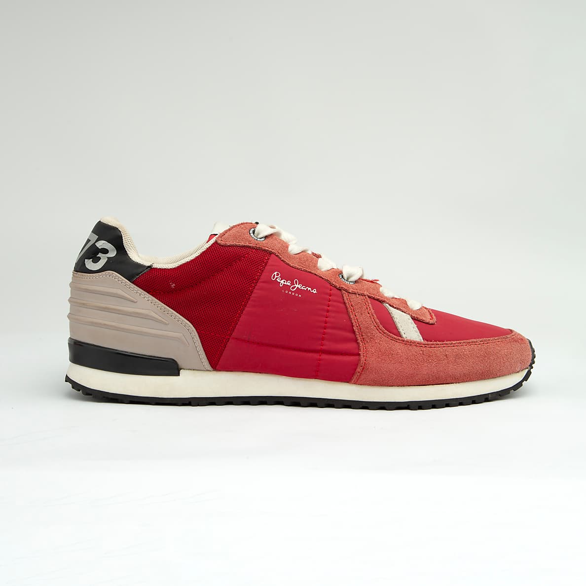 These are stylish, casual low-top sneakers featuring a mixed-material upper that includes a combination of suede, textile (mesh/nylon), and synthetic overlays.