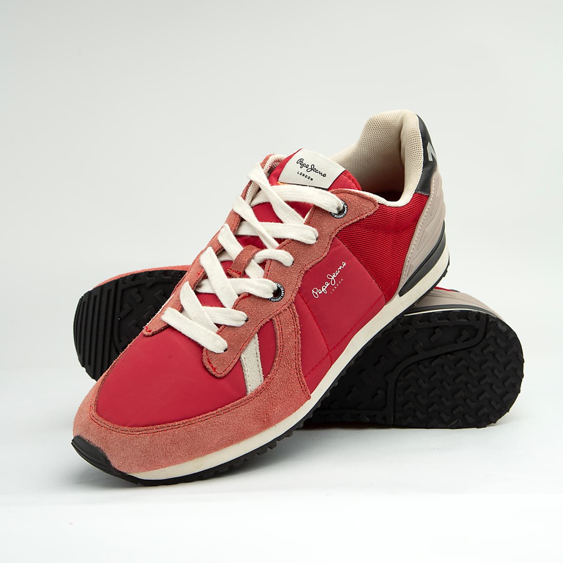 These are stylish, casual low-top sneakers featuring a mixed-material upper that includes a combination of suede, textile (mesh/nylon), and synthetic overlays.