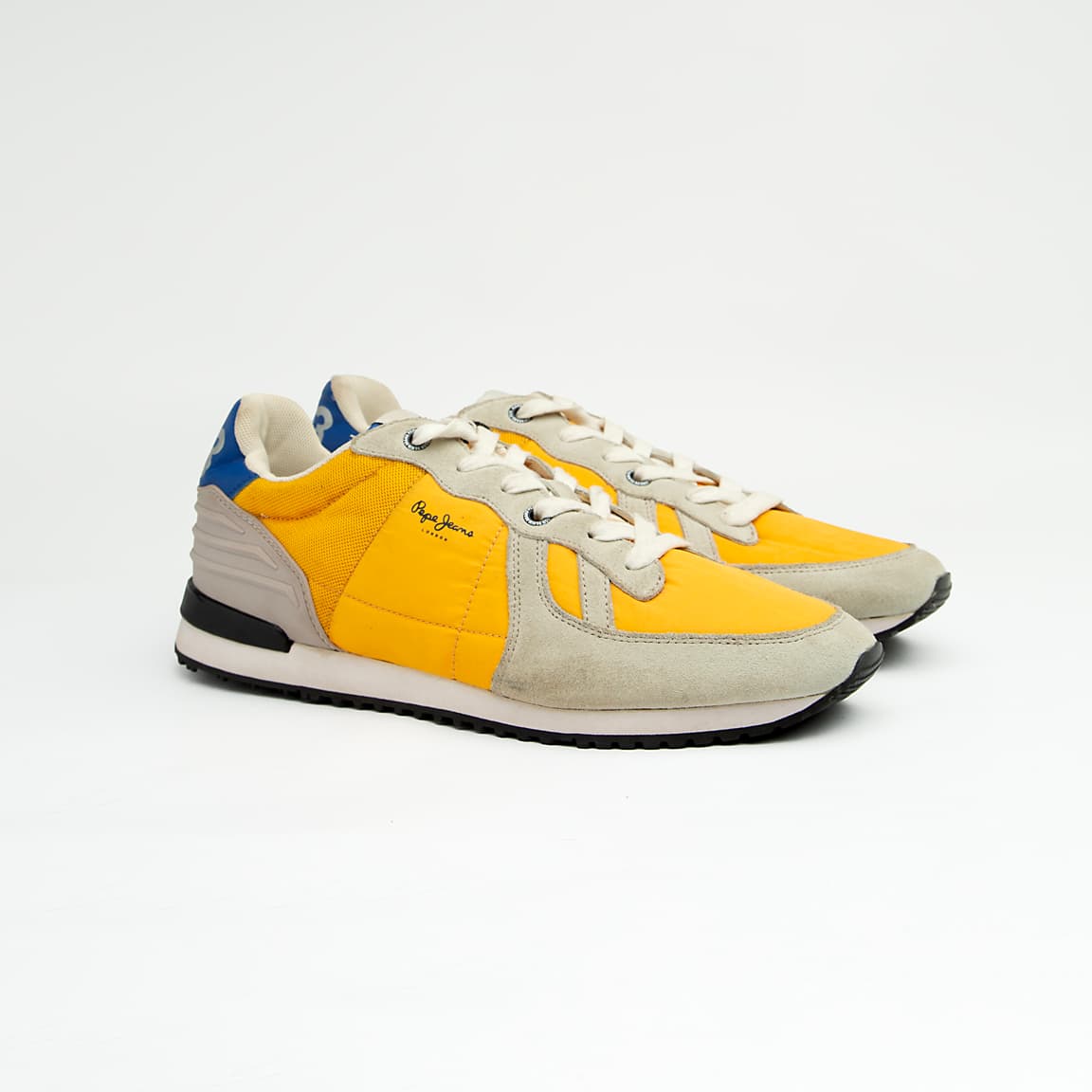 The Canary Retro Cruiser is a bright, casual runner-style sneaker that embodies vintage athletic design.
