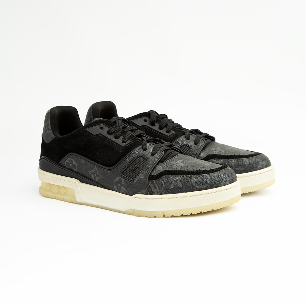 The Obsidian Monogram Ace is a high-fashion low-top sneaker that remixes a vintage court shoe silhouette with signature luxury detailing.