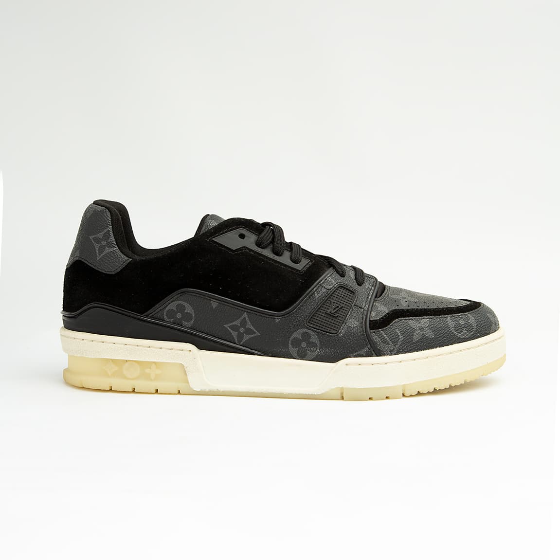 The Obsidian Monogram Ace is a high-fashion low-top sneaker that remixes a vintage court shoe silhouette with signature luxury detailing.