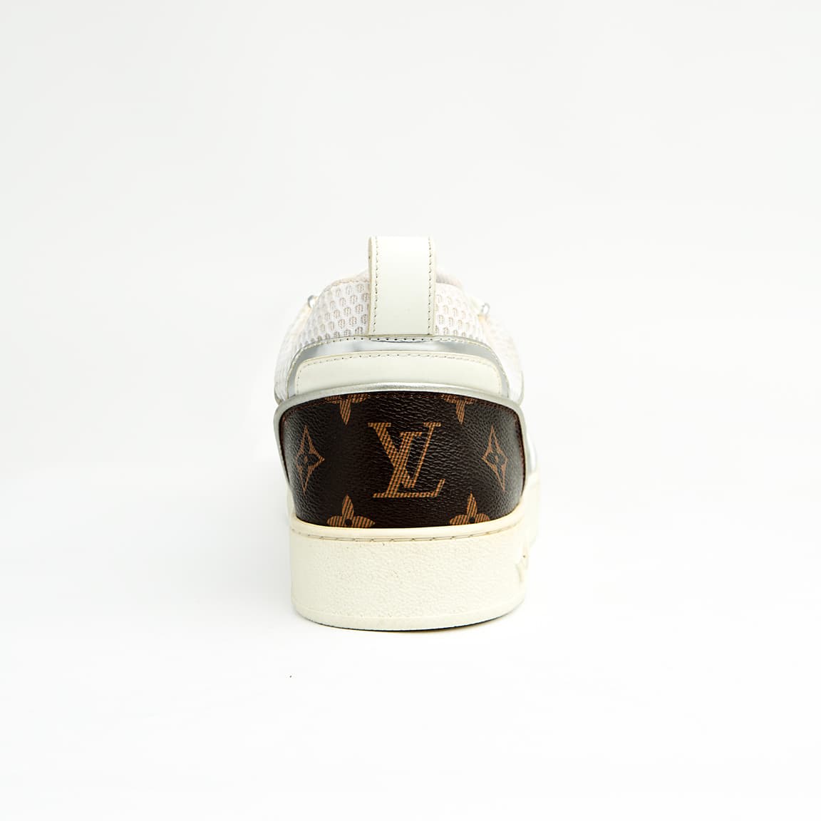 Dual-tone brown and silver unisex monogram embossed leather sneakers with classic design and comfortable sole.