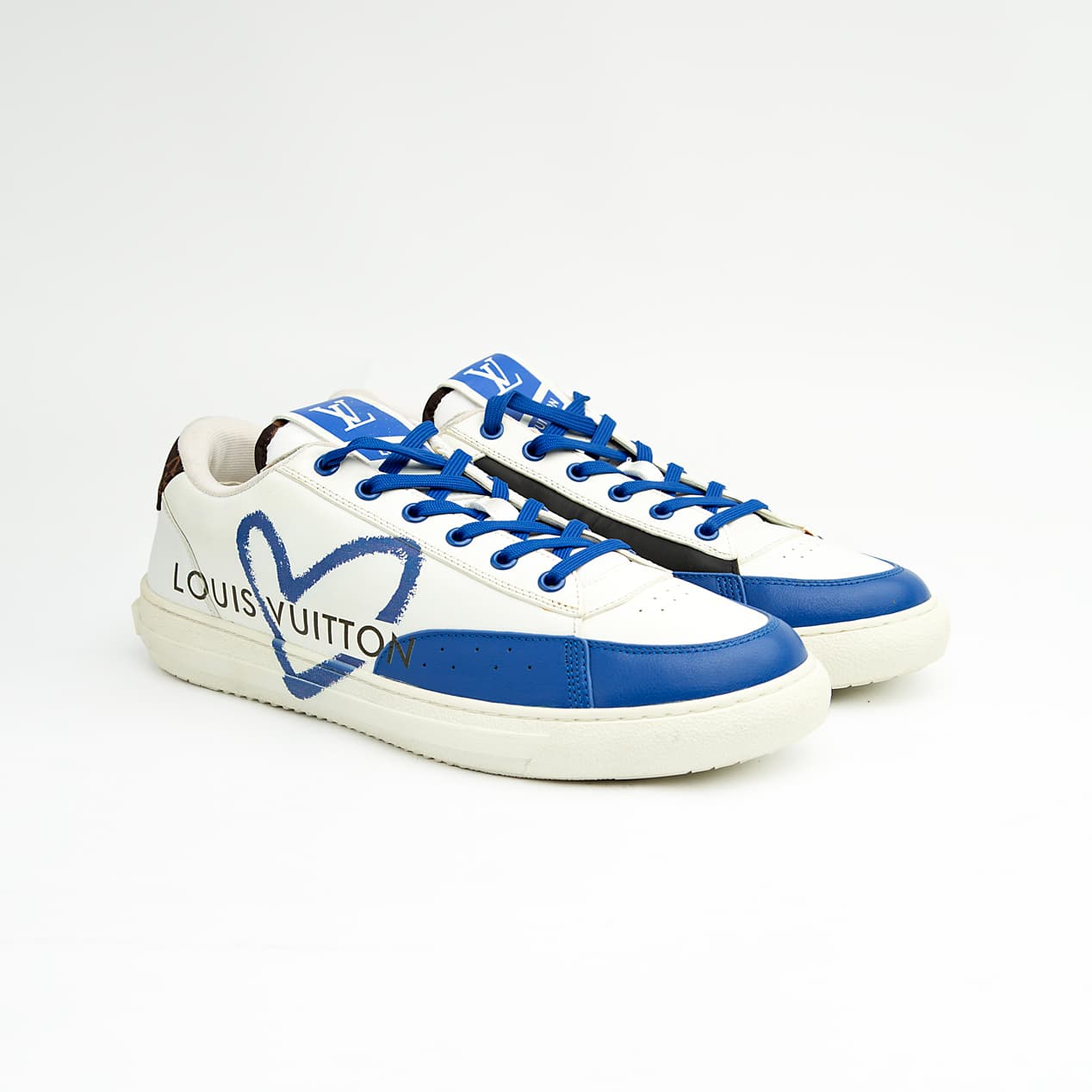 Louis Vuitton Blue Heart unisex sneakers with white leather base, blue detailing, and LV heart design — luxury designer footwear.