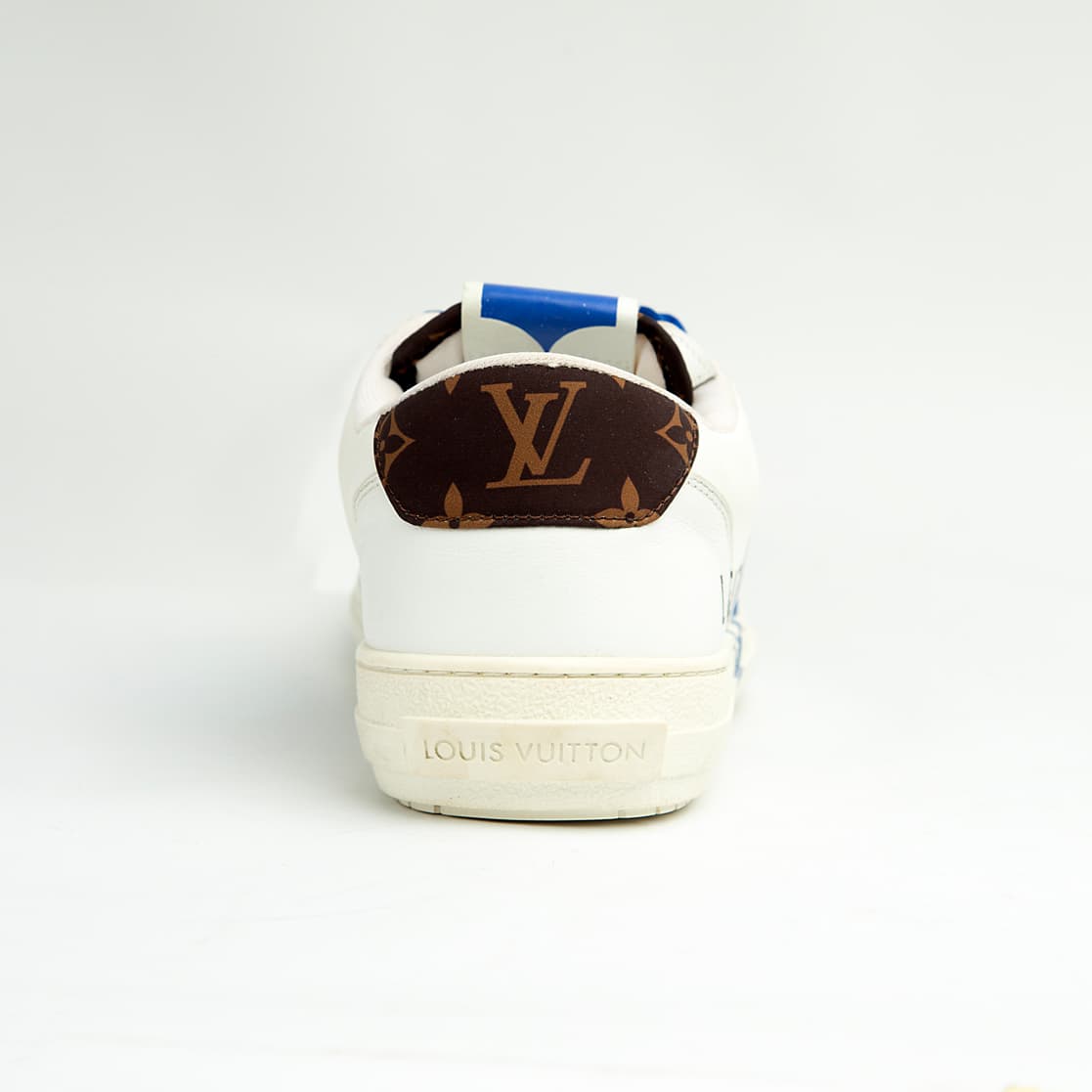 Louis Vuitton Blue Heart unisex sneakers with white leather base, blue detailing, and LV heart design — luxury designer footwear.